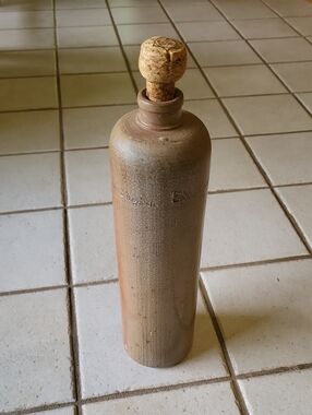 Stoneware Bottle - Neutral Tan. T LOOTSJE AMSTERDAM ERVEN LOO BOOS